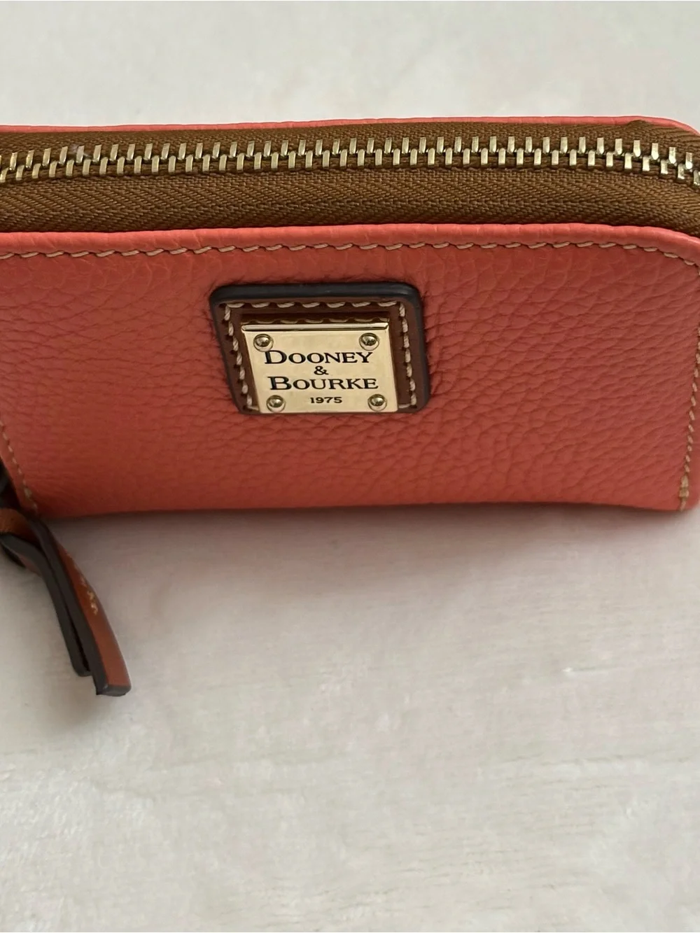 Dooney & Bourke Pebble Grain Large Zip Around Credit Card Case  Coral Color.